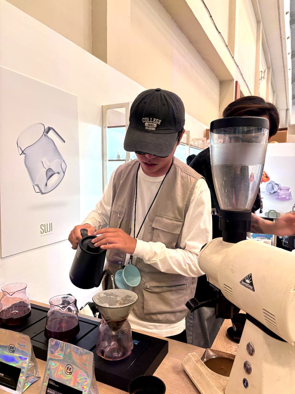 Didi brewing coffee at the SUJI booth
